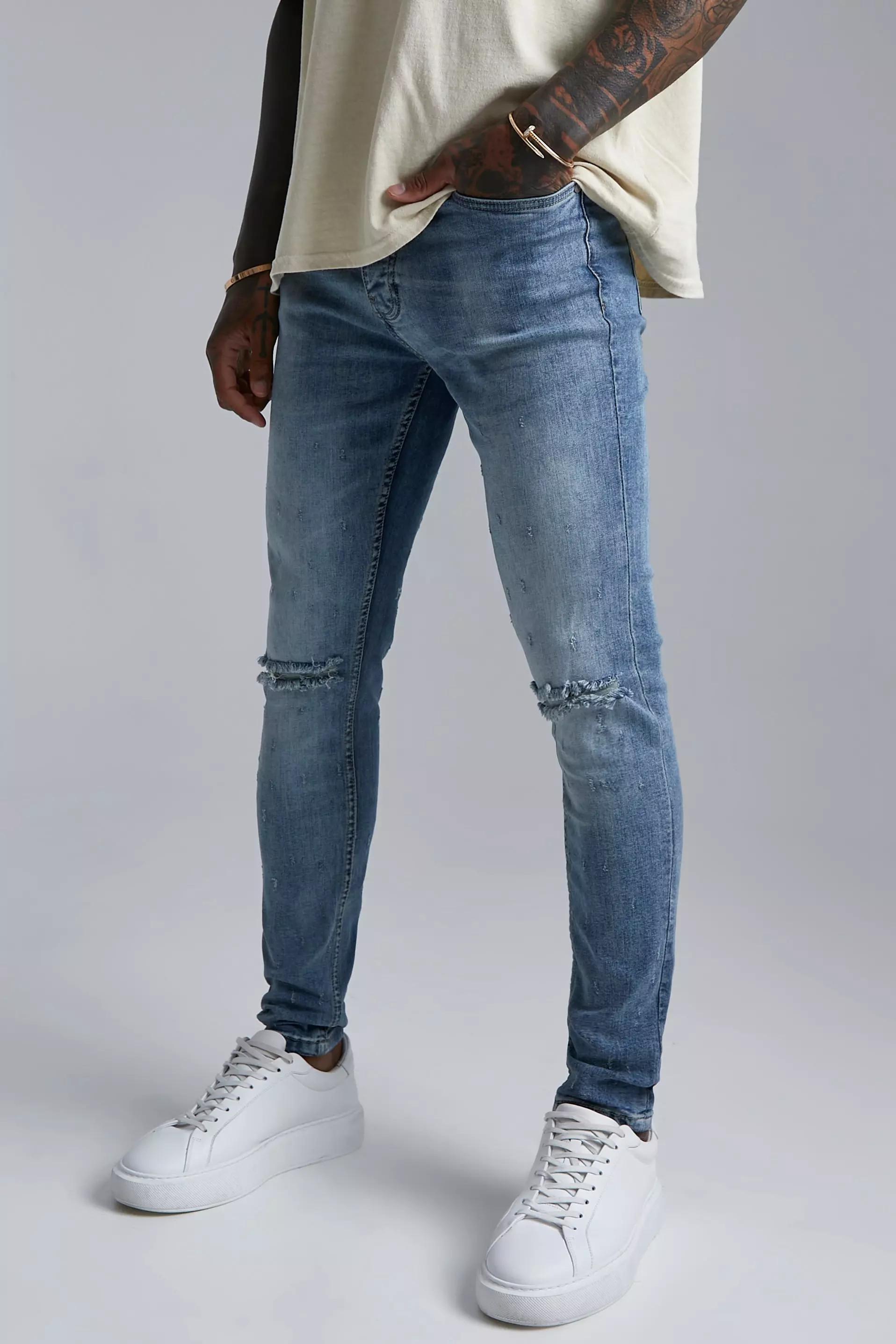 Busted knee hot sale skinny jeans